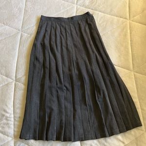 Gray pleated skirt.